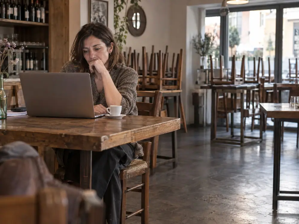 Owner reviewing the schedules on a laptop